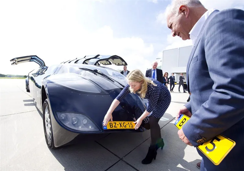 Wubbo Ockels looking at Superbus as it receives its licence plate