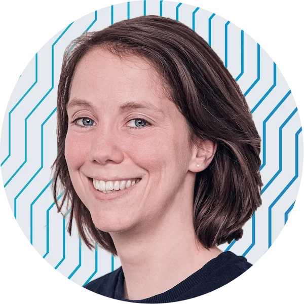 Tine's headshot, smiling brightly against a wavy blue backdrop